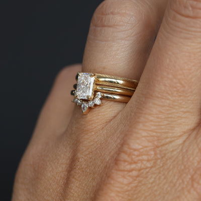 1.00ct Radiant Cut Diamond Solitaire engagement ring with wedding bands on hand