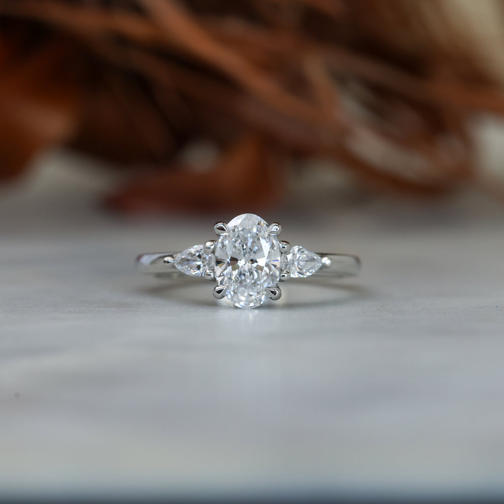 1.00ct oval cut diamond trilogy engagement ring platinum
