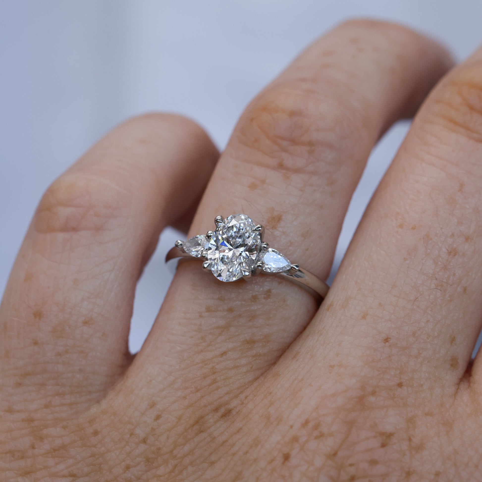 1.00ct oval cut diamond trilogy engagement ring platinum