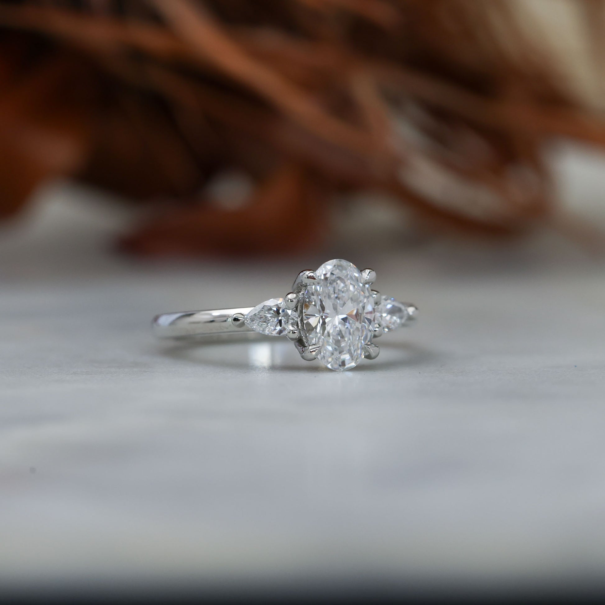 1.00ct oval cut diamond trilogy engagement ring platinum