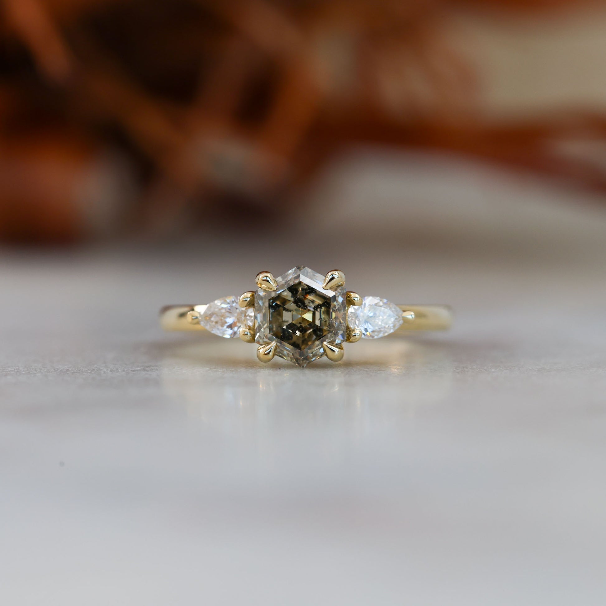 natural hexagon cut salt and pepper champagne diamond trilogy engagement ring yellow gold