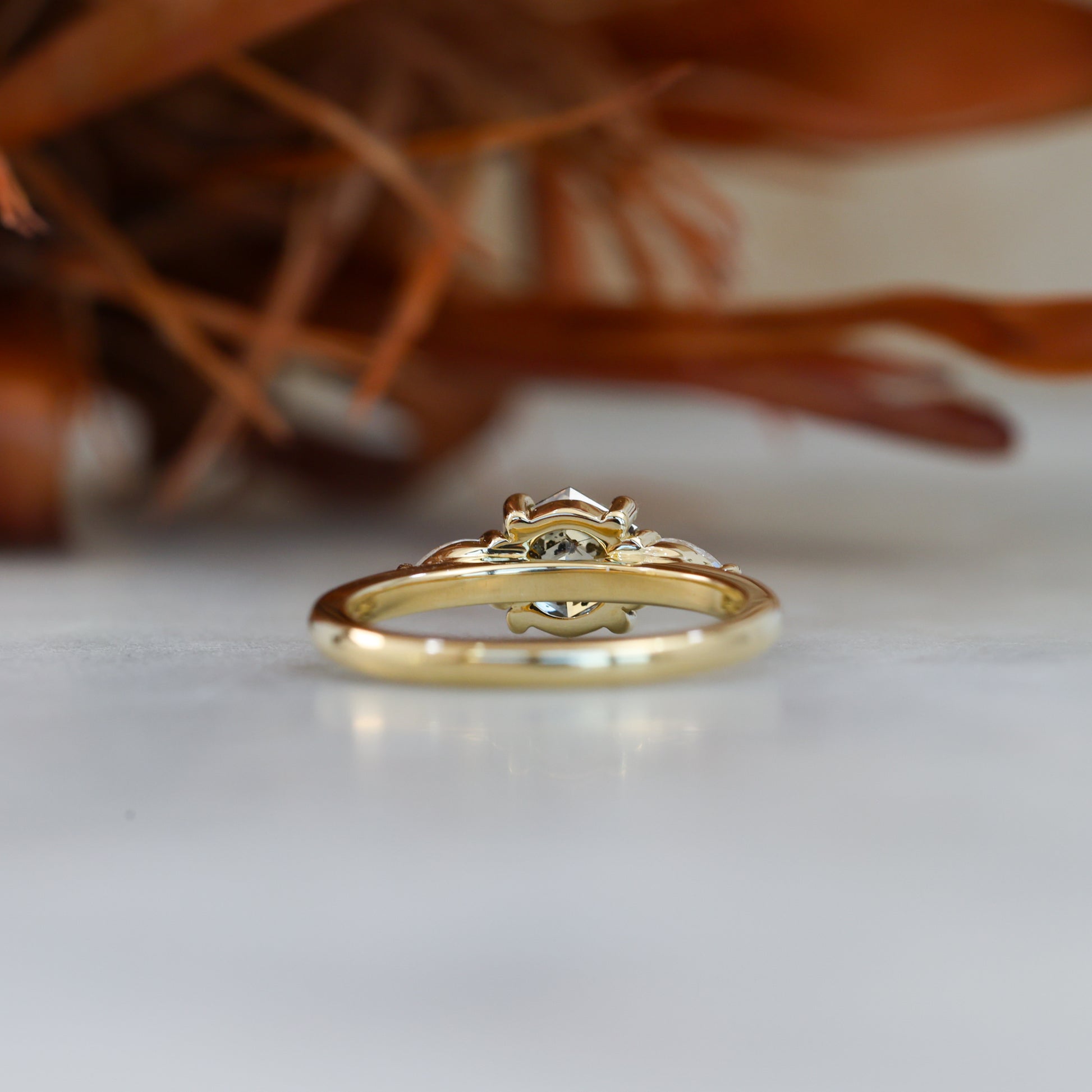 natural hexagon cut salt and pepper champagne diamond trilogy engagement ring yellow gold