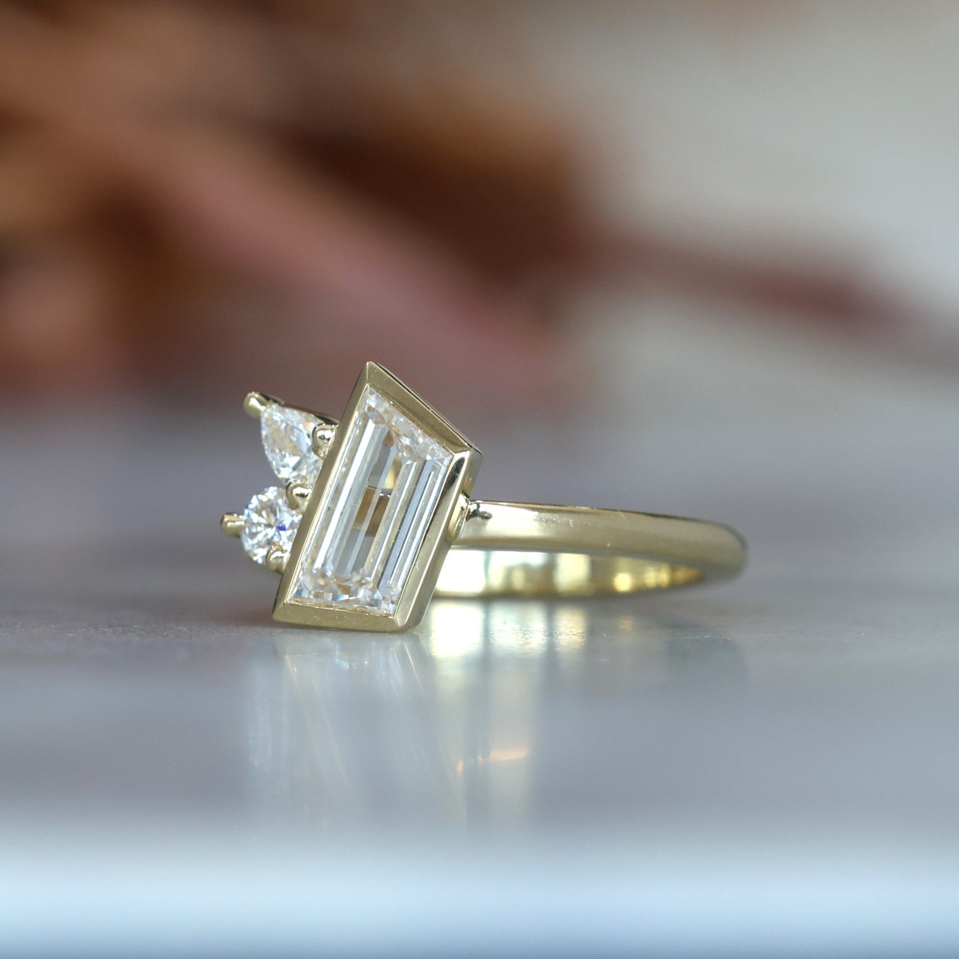 1.02ct Trapeze cut diamond Bezel Set Engagement ring front side view