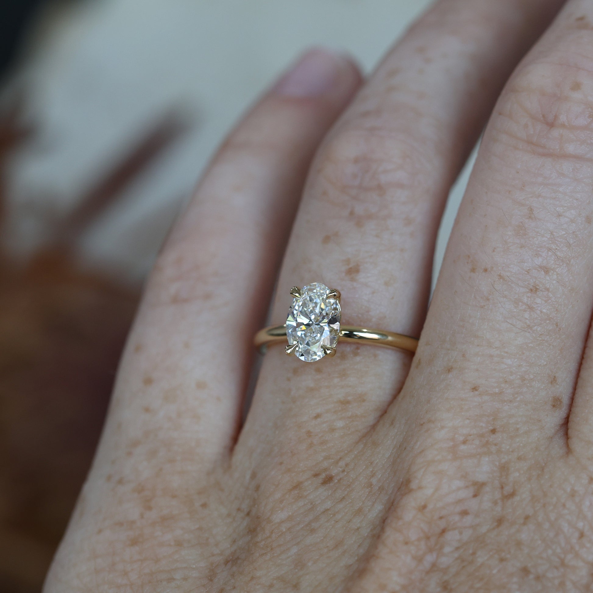 1.04ct Oval_Diamond Solitaire engagement ring on hand