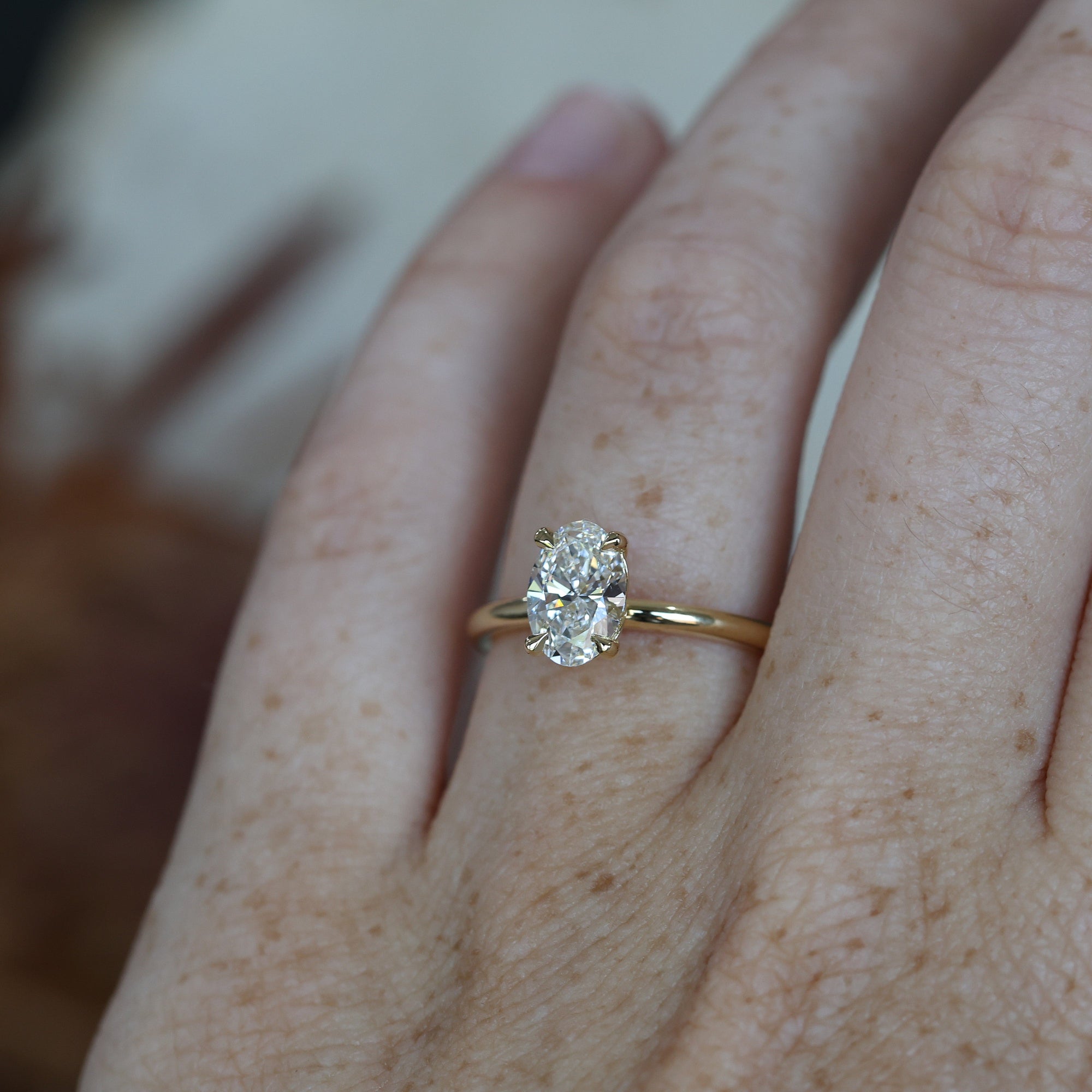 1.04ct Oval_Diamond Solitaire engagement ring on hand