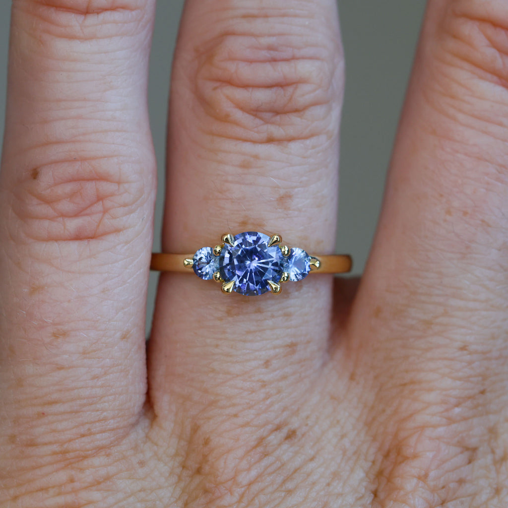 1.07ct ceylon sapphire triple lunar trilogy engagement ring on hand