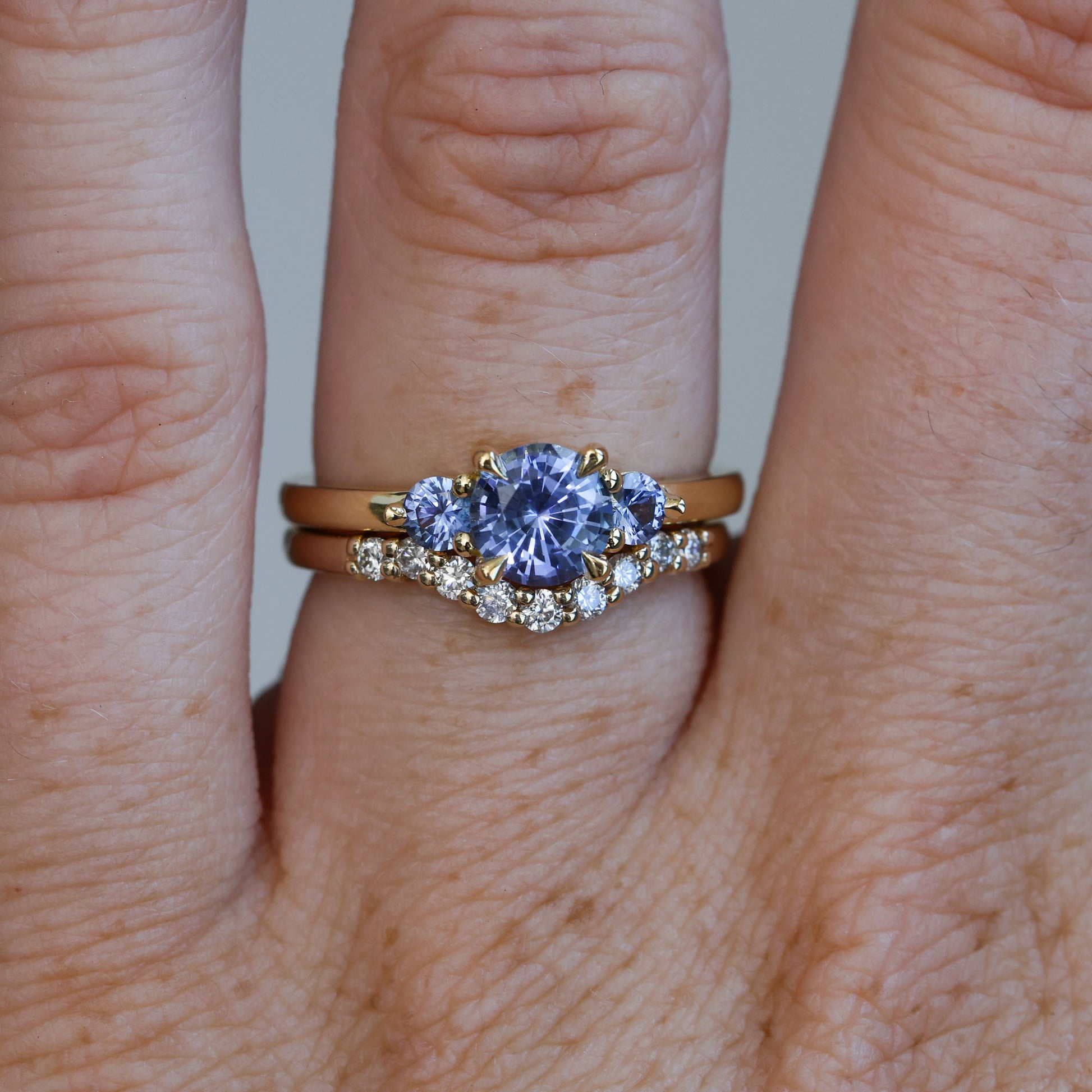 1.07ct ceylon sapphire triple lunar trilogy engagement ring on hand wedding band