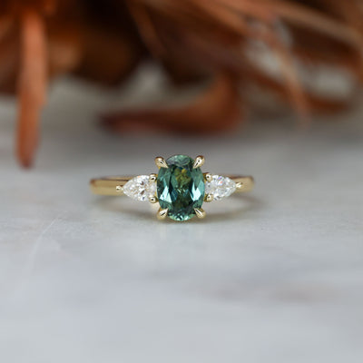 1.11ct oval cut australian sapphire trilogy engagement ring