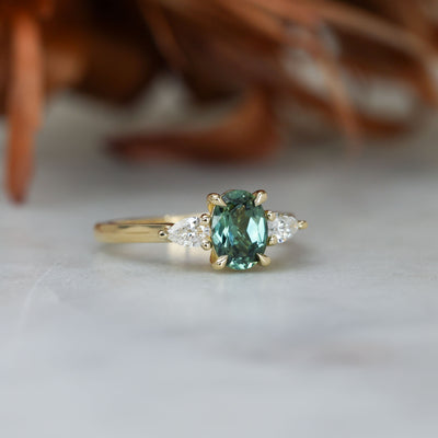 1.11ct oval cut australian sapphire trilogy engagement ring