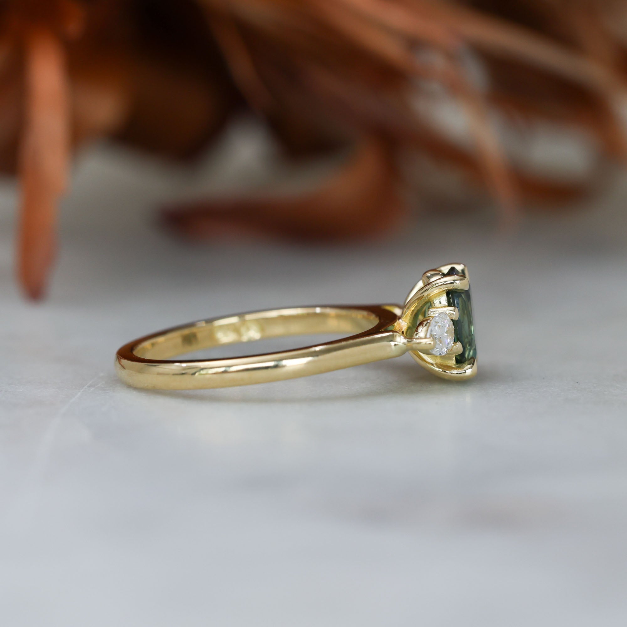 1.11ct oval cut australian sapphire trilogy engagement ring side