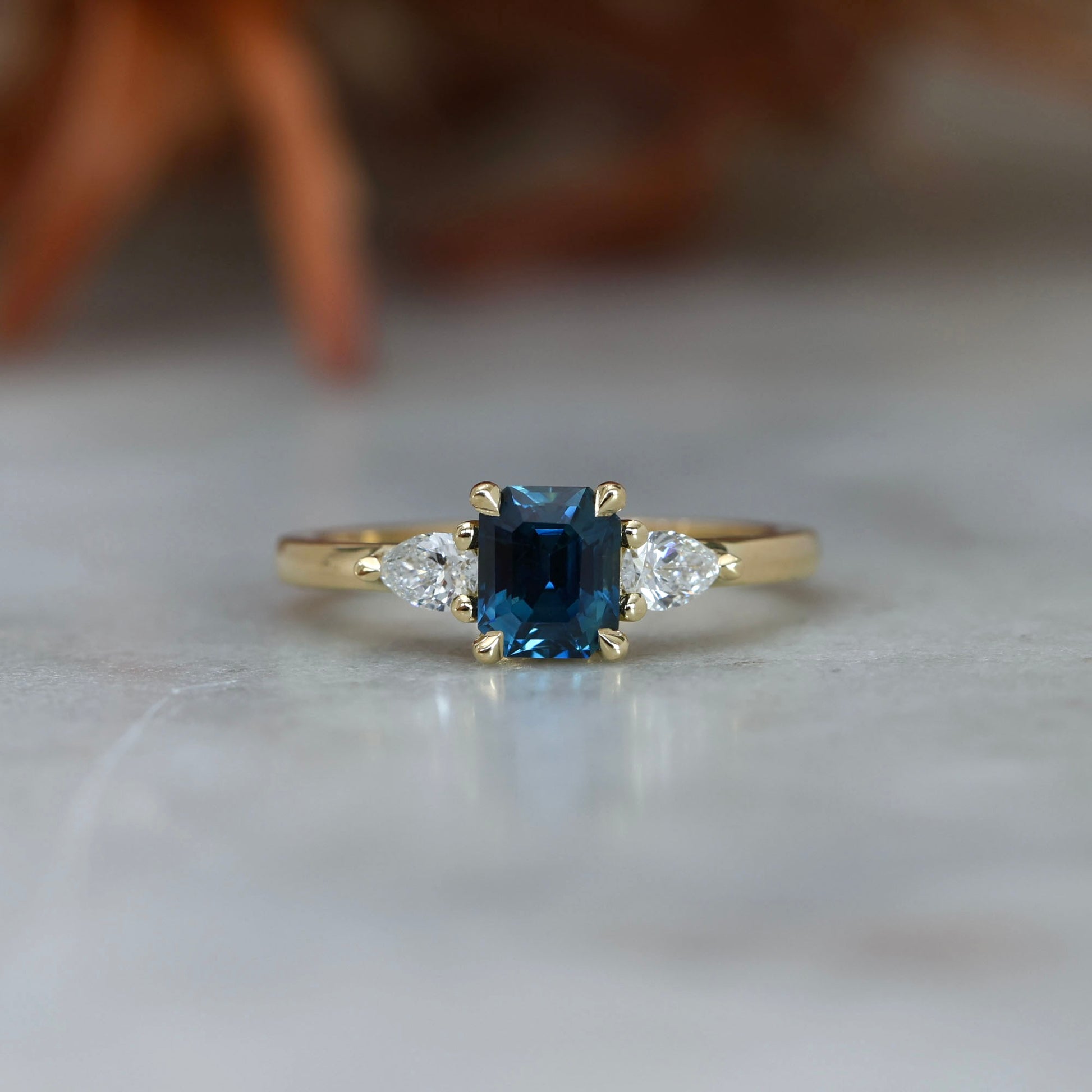 1.13ct emerald cut Madagascan sapphire trilogy engagement ring front view