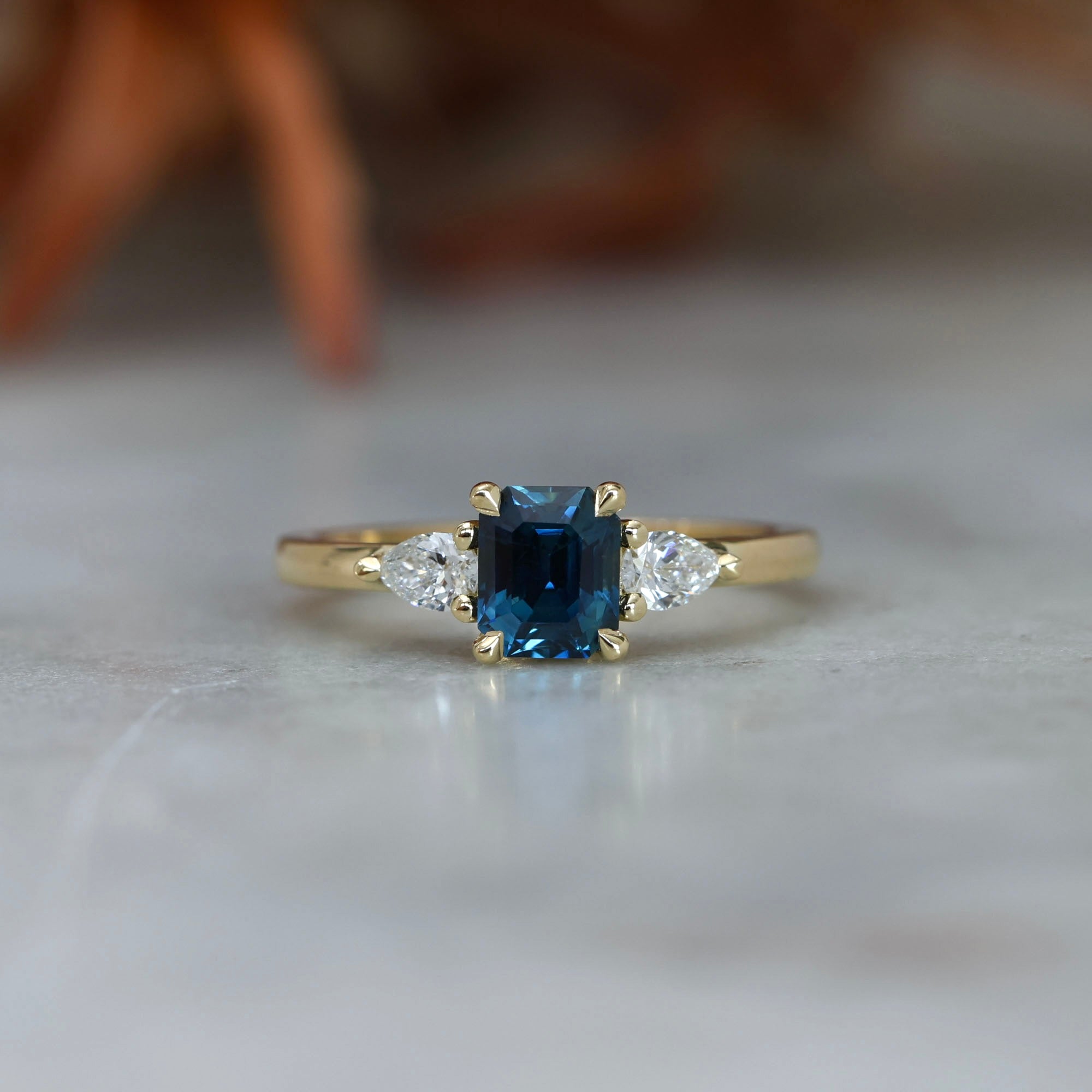 1.13ct emerald cut Madagascan sapphire trilogy engagement ring front view