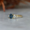 1.13ct emerald cut Madagascan sapphire trilogy engagement ring front side view