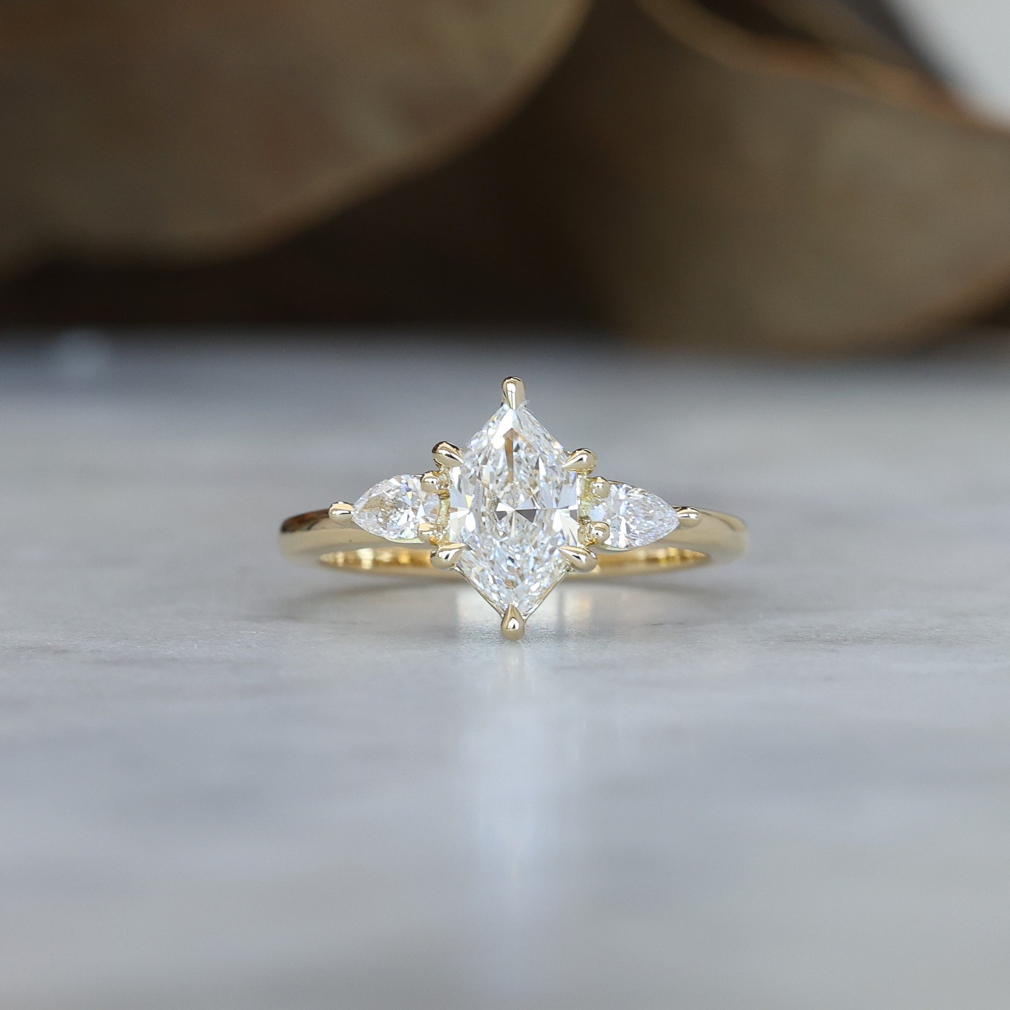 1.15ct Elongated Hexagon Diamond trilogy engagement ring