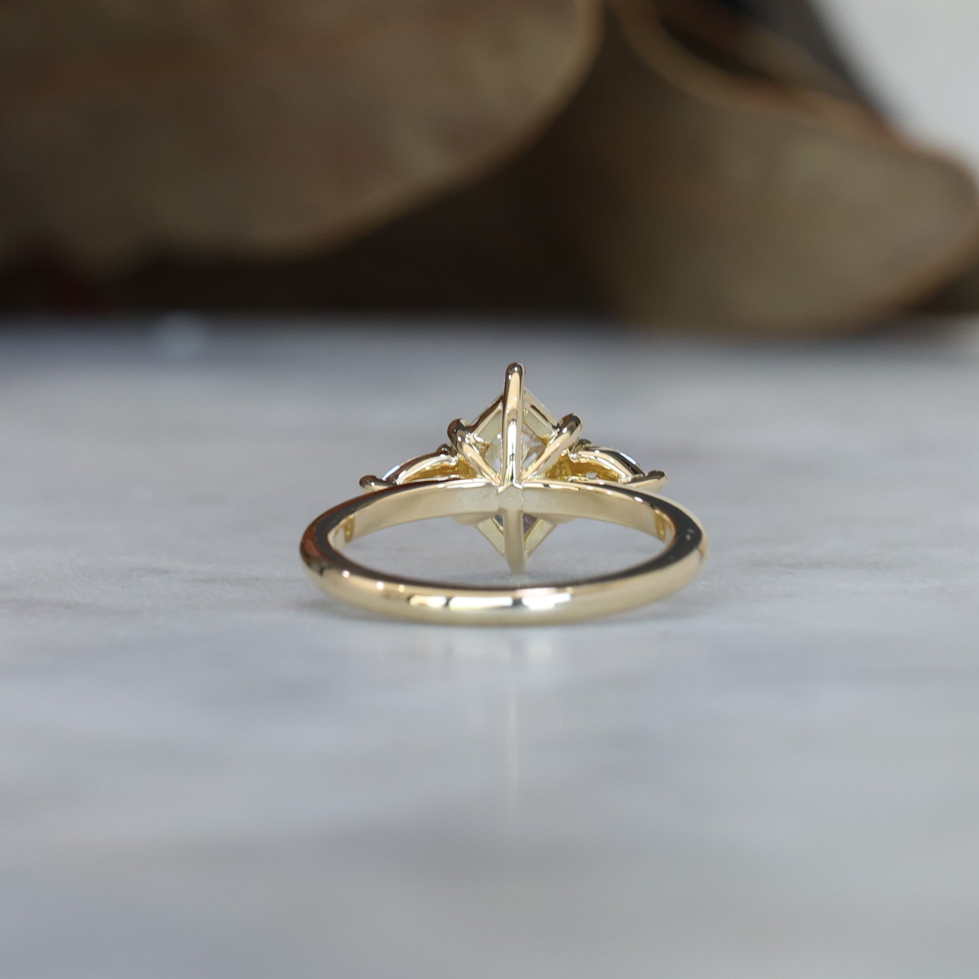 1.15ct Elongated Hexagon Diamond trilogy engagement ring back view