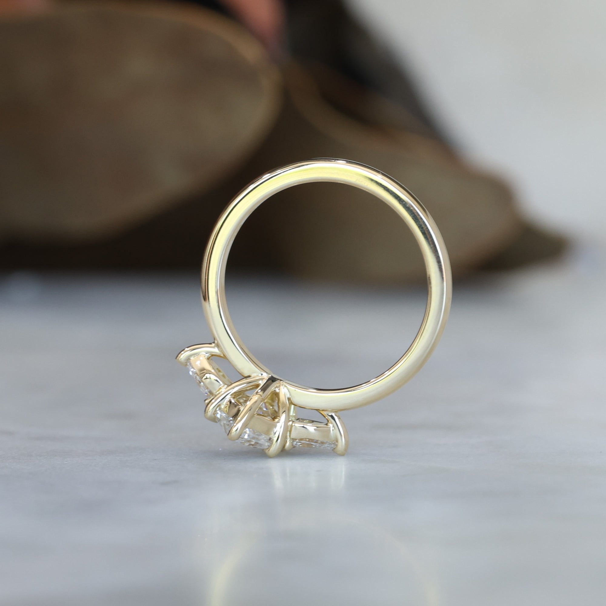 1.15ct Elongated Hexagon Diamond trilogy engagement ring edge view