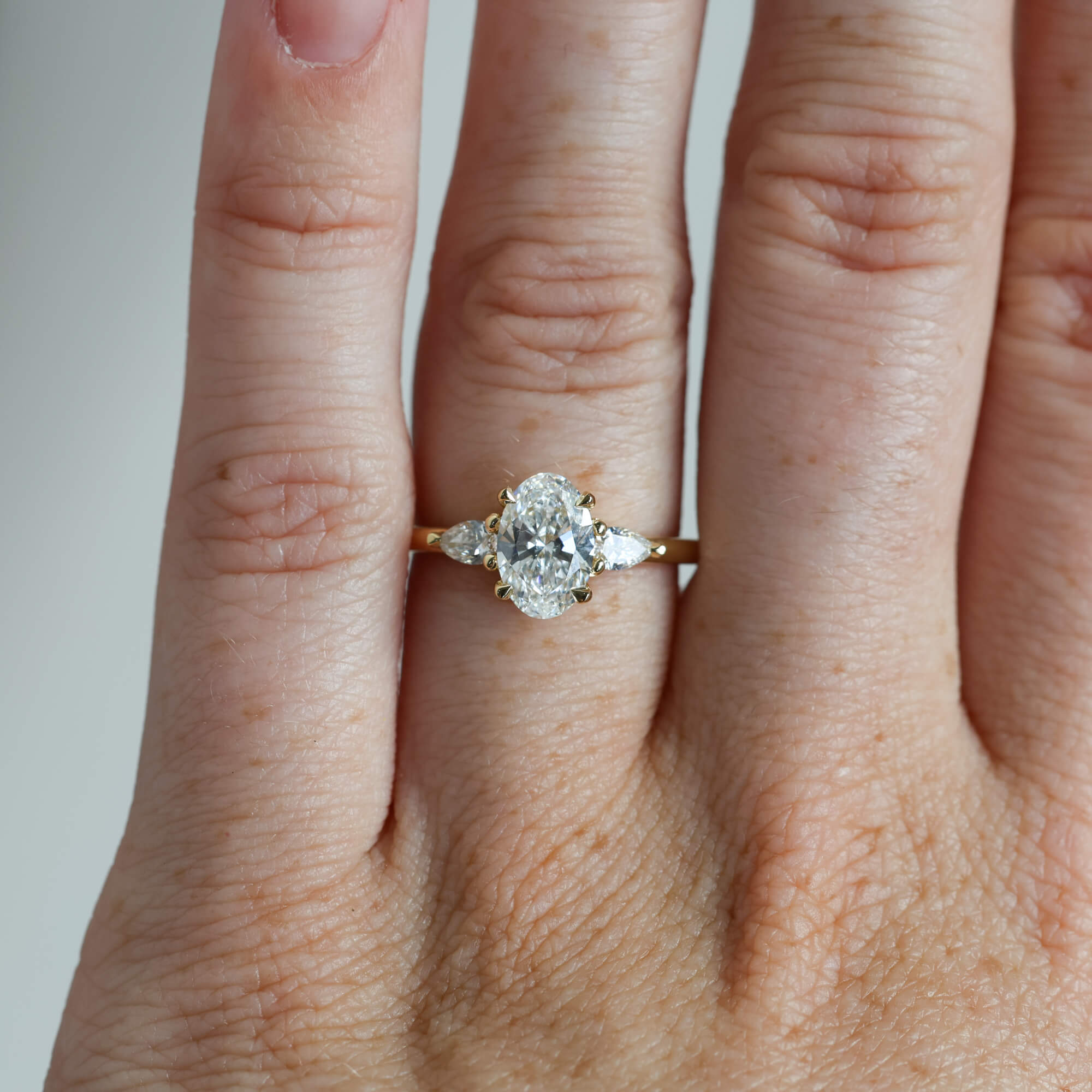 1.18ct Oval Lab Diamond trilogy Engagement ring on hand