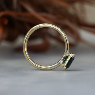 1.20ct emerald cut australian parti saphire east west semi bezel engagement ring profile