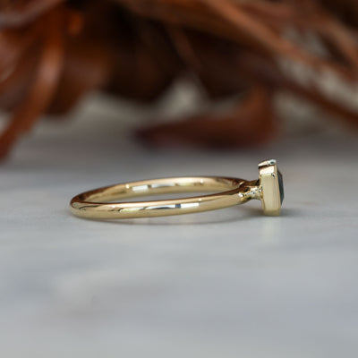 1.20ct emerald cut australian parti saphire east west semi bezel engagement ring side profile