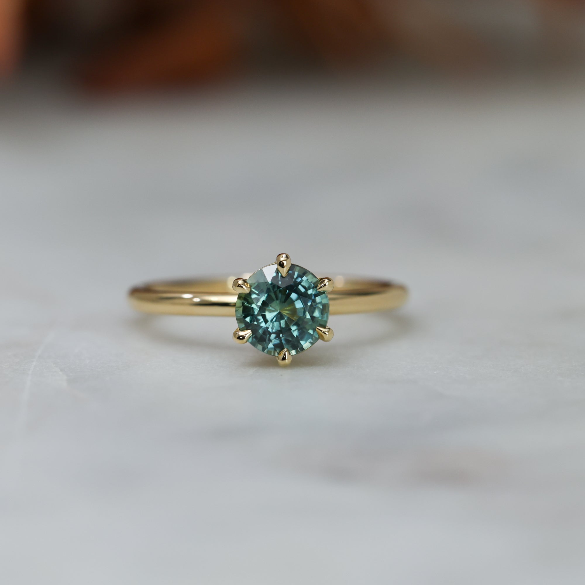 1.20ct round cut madagascan sapphire solitaire engagement ring, set in 18ct yellow gold front view