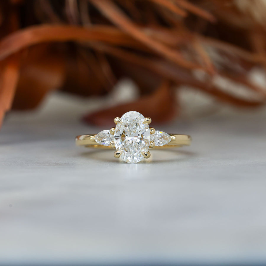 1.25ct oval cut diamond may trilogy engagement ring