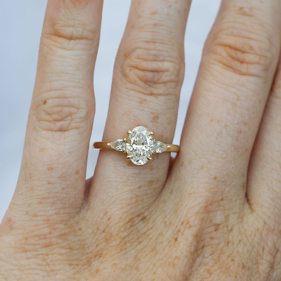 1.25ct oval cut diamond may trilogy engagement ring