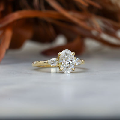 1.25ct oval cut diamond may trilogy engagement ring