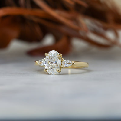 1.25ct oval cut diamond may trilogy engagement ring