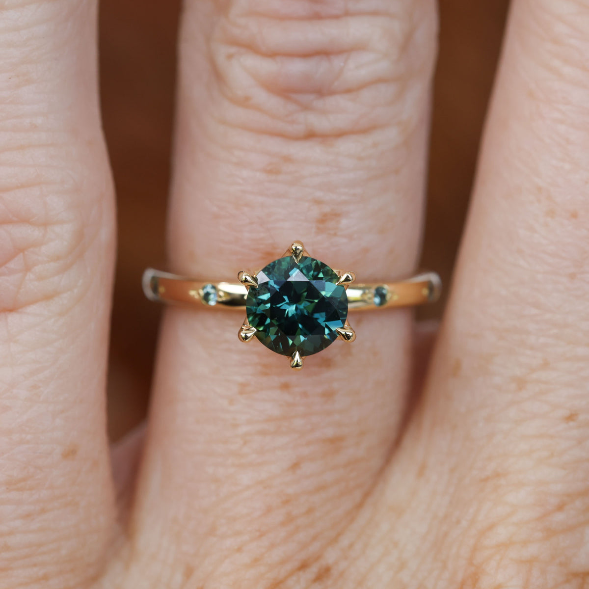 1.28ct round cut australian sapphire lotus sapphire stardust engagement ring on hand