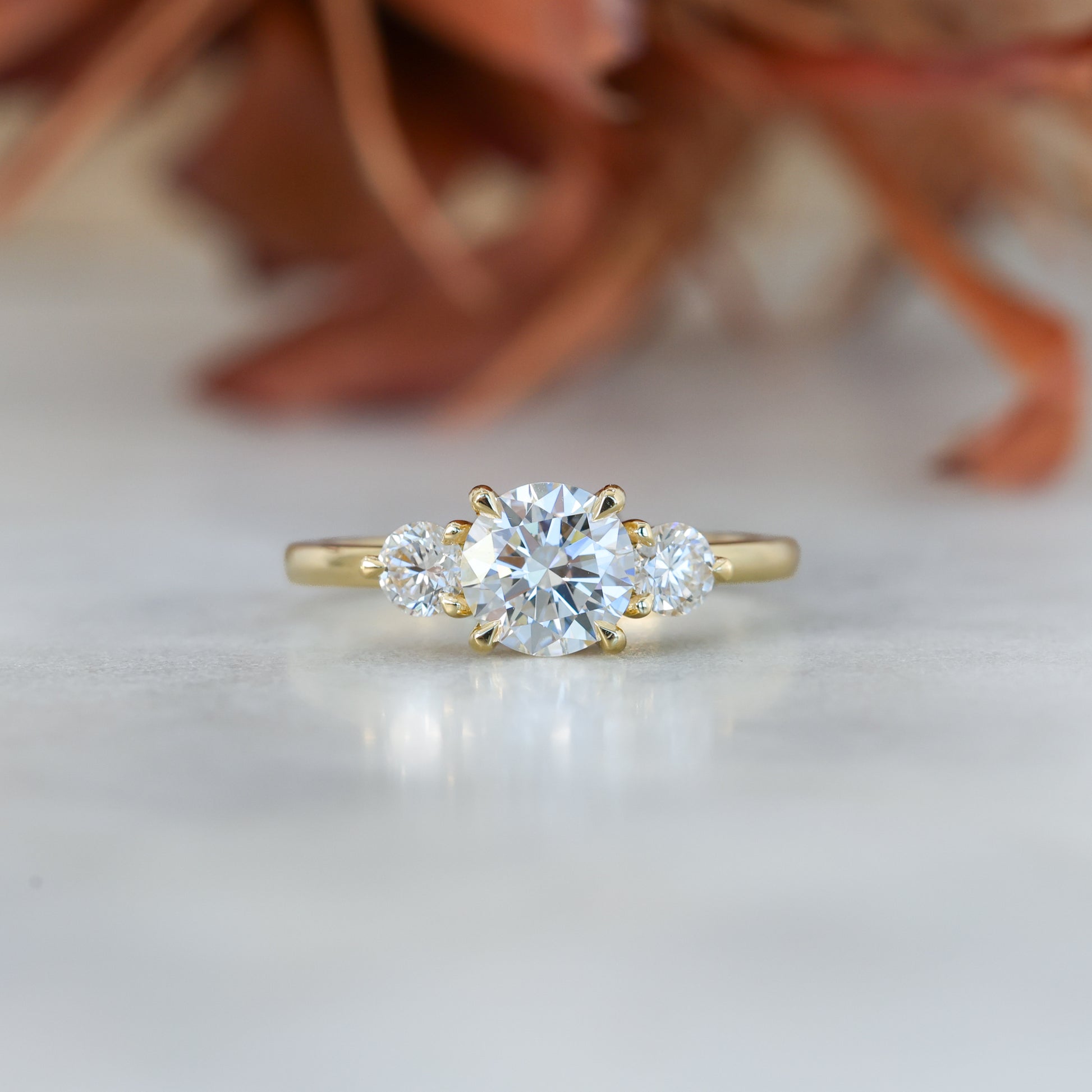 diamond round cut trilogy engagement ring yellow gold