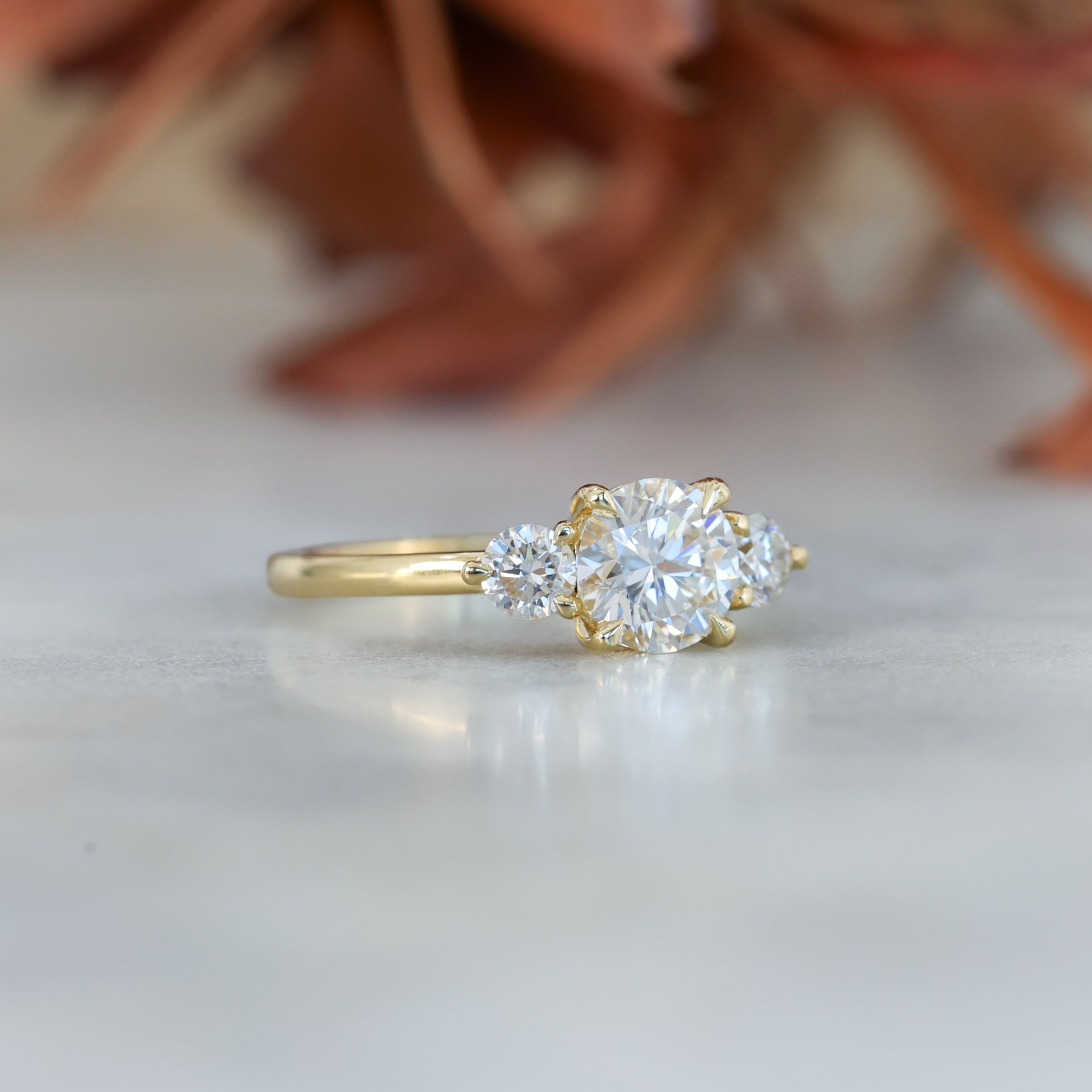 diamond round cut trilogy engagement ring yellow gold