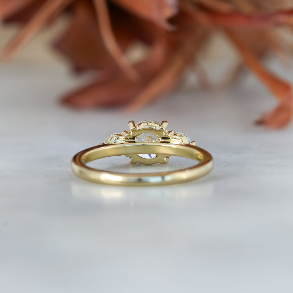 diamond round cut trilogy engagement ring yellow gold