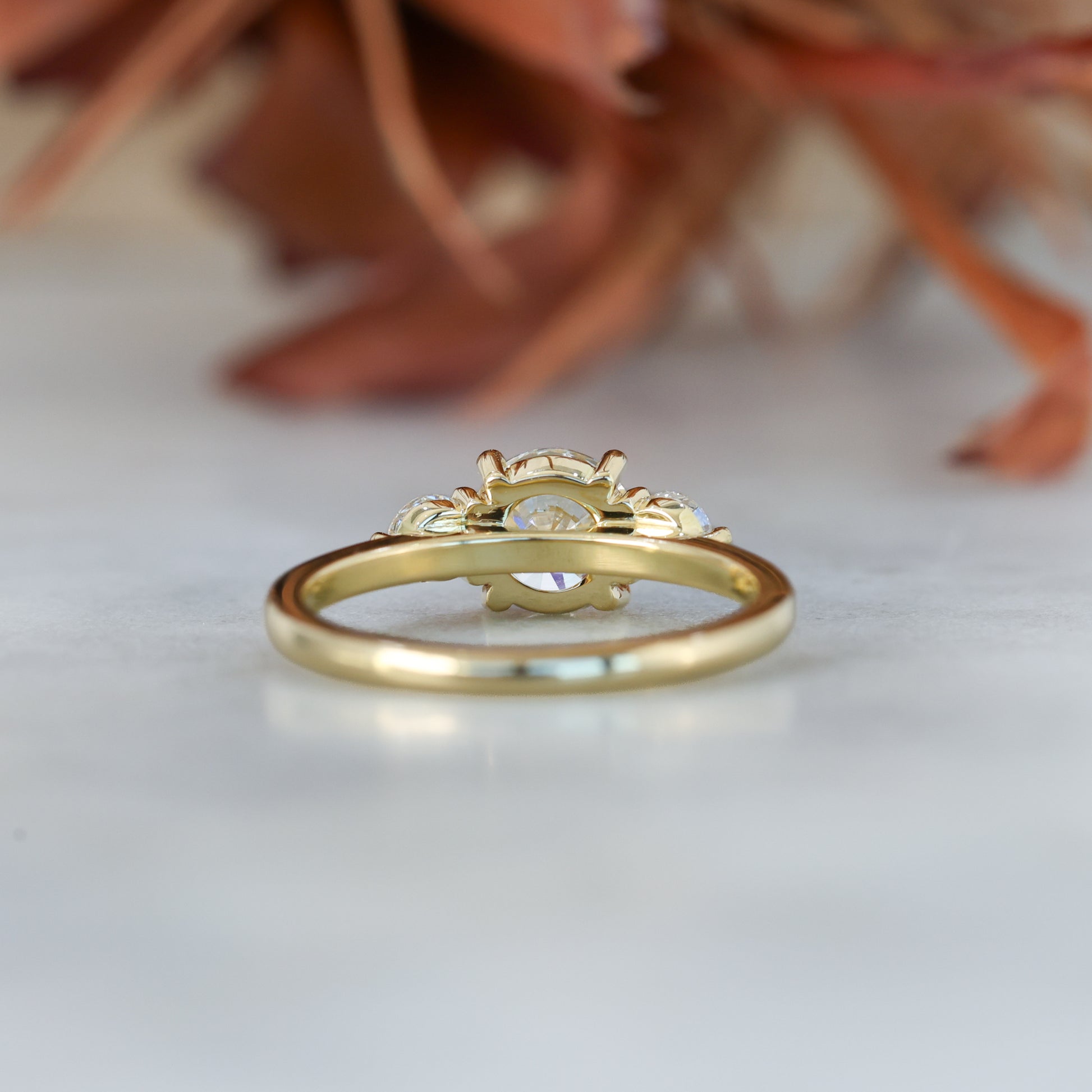 diamond round cut trilogy engagement ring yellow gold