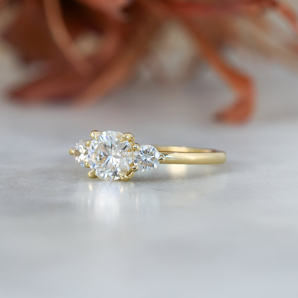 diamond round cut trilogy engagement ring yellow gold