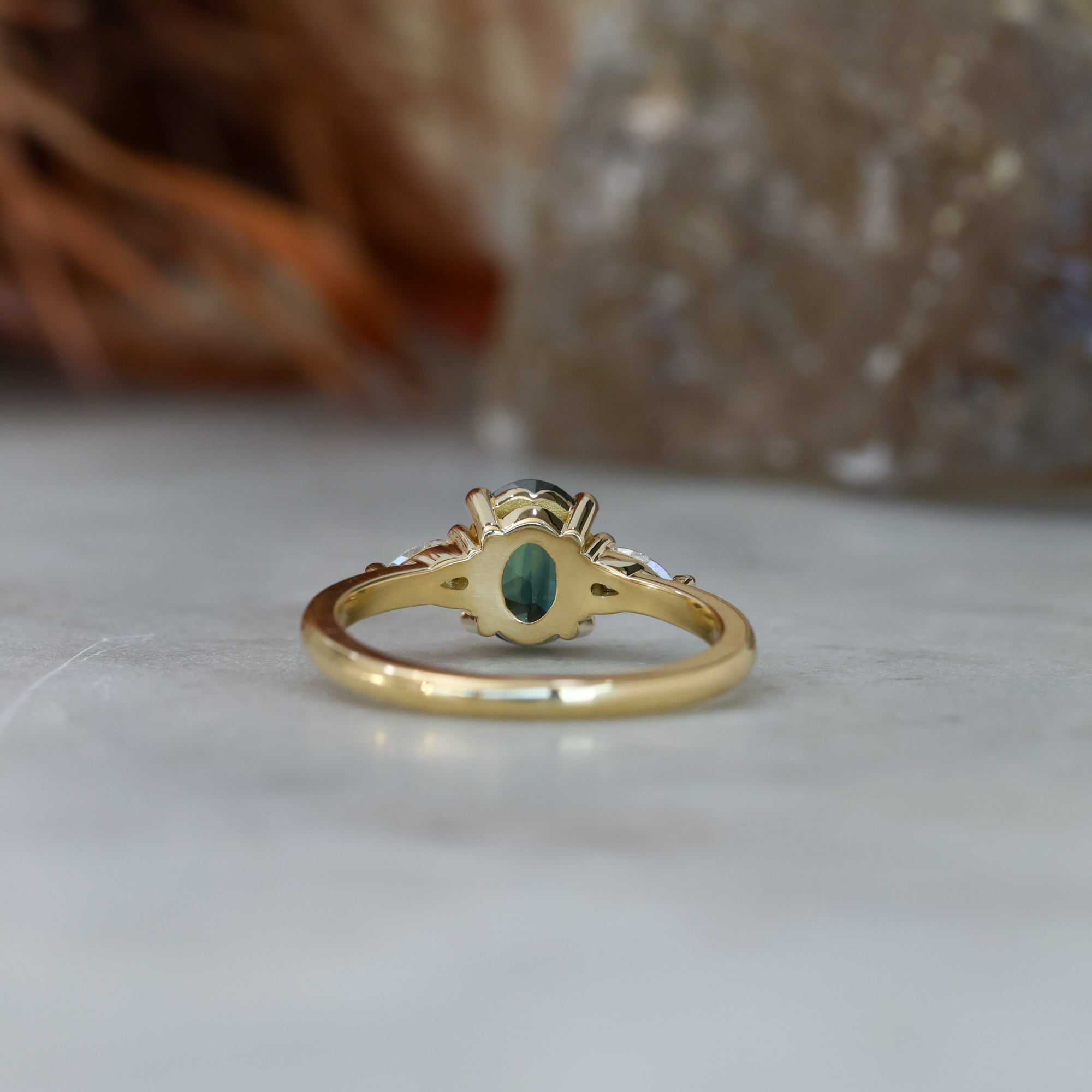 1.31ct Oval Cut australian Parti sapphire trilogy engagement ring back view