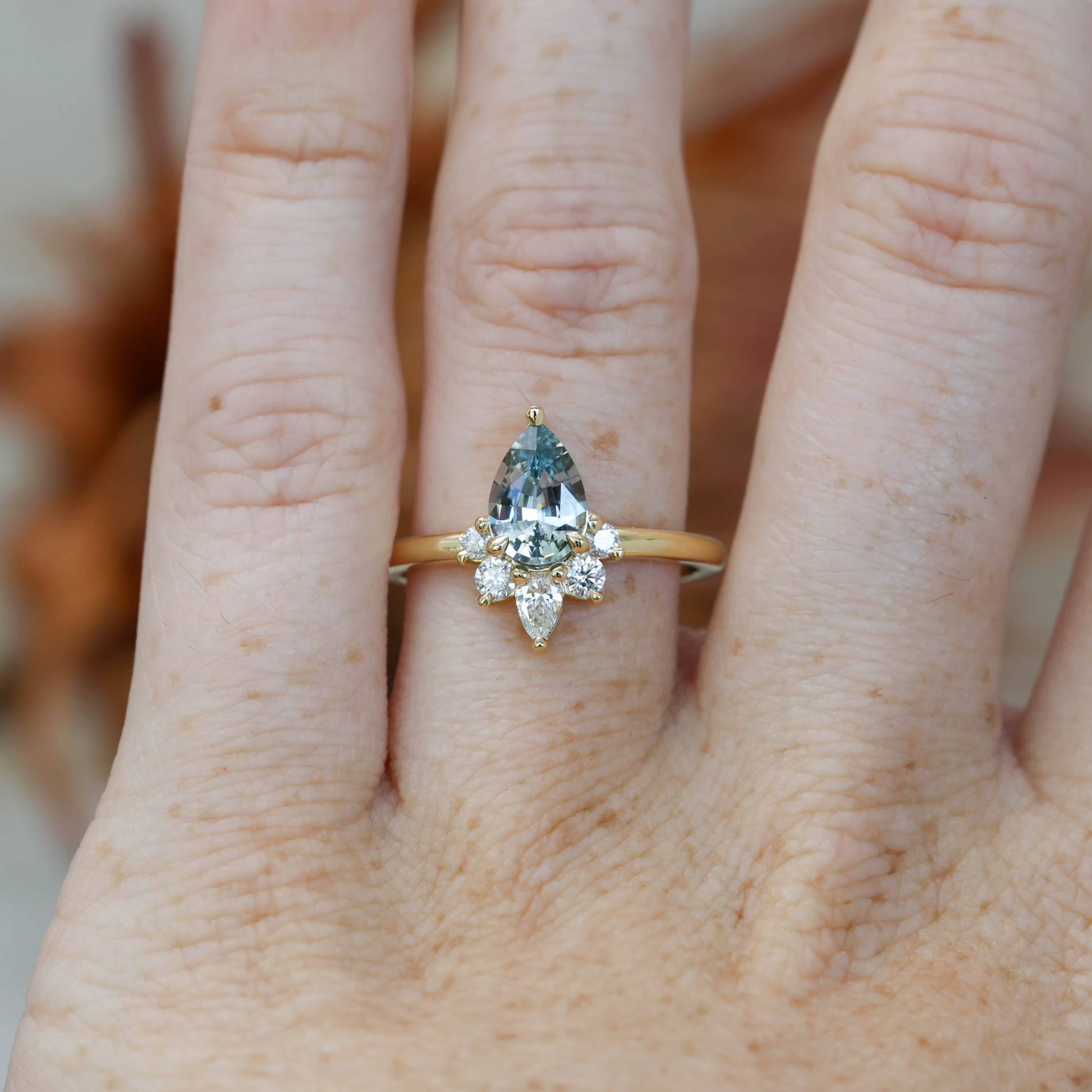 1.32ct madagascan Sapphire & Diamond half halo engagement ring on hand