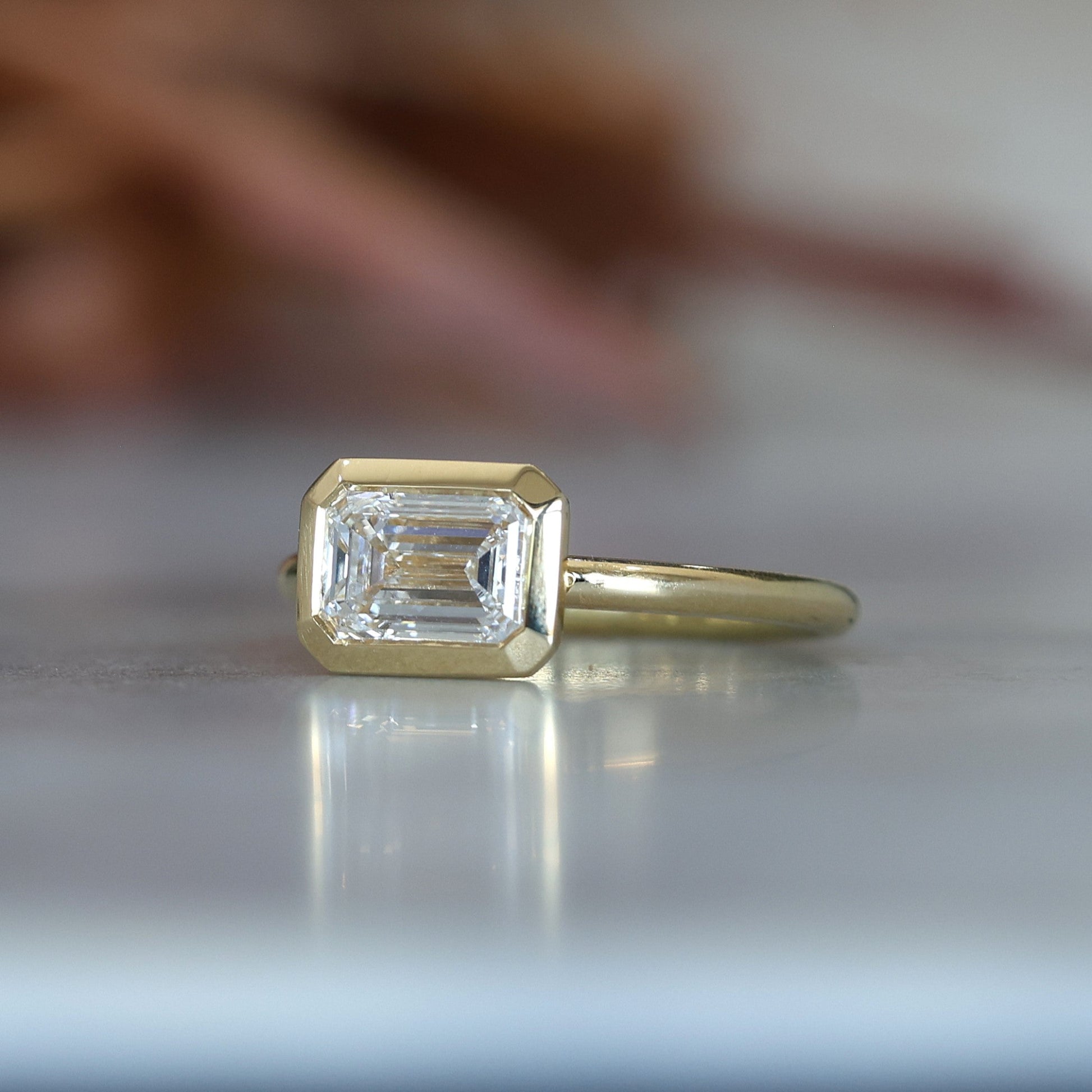 1.36ct Emerald Cut Bezel Engagement ring