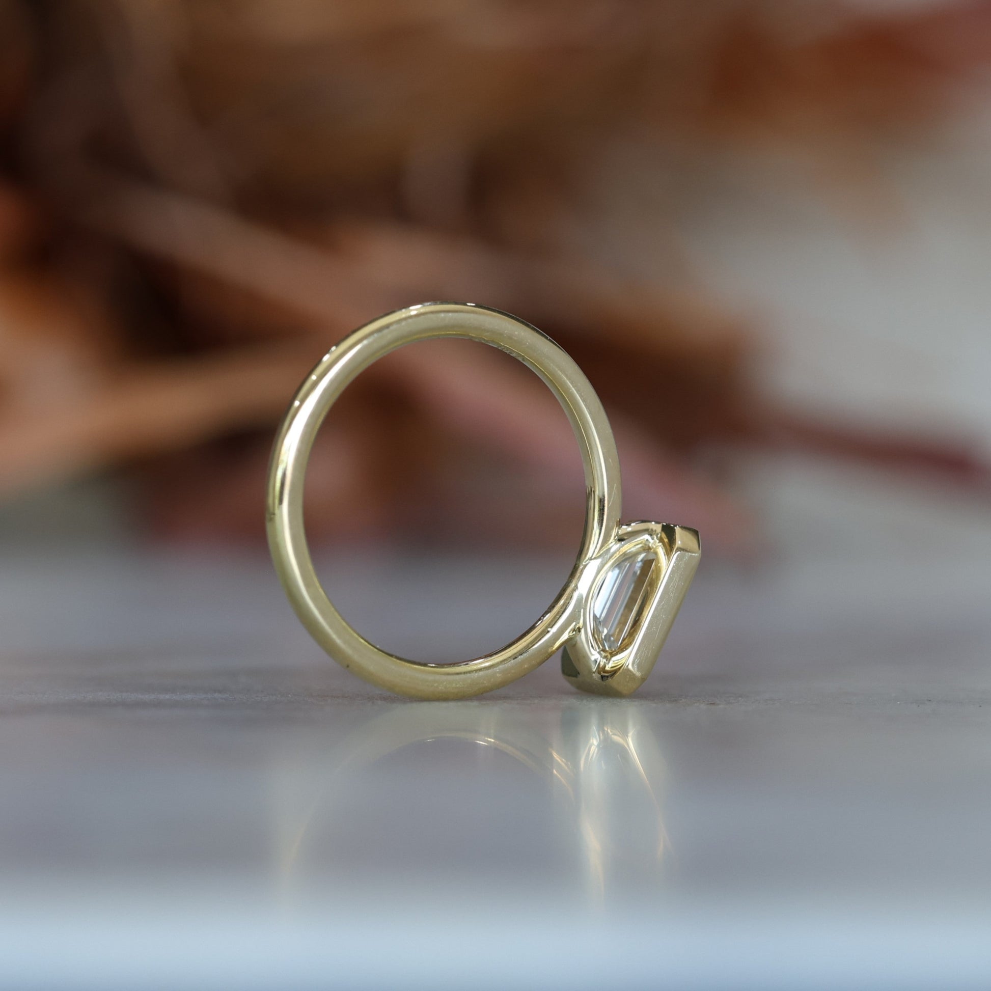 1.36ct Emerald Cut Bezel Engagement ring profile view