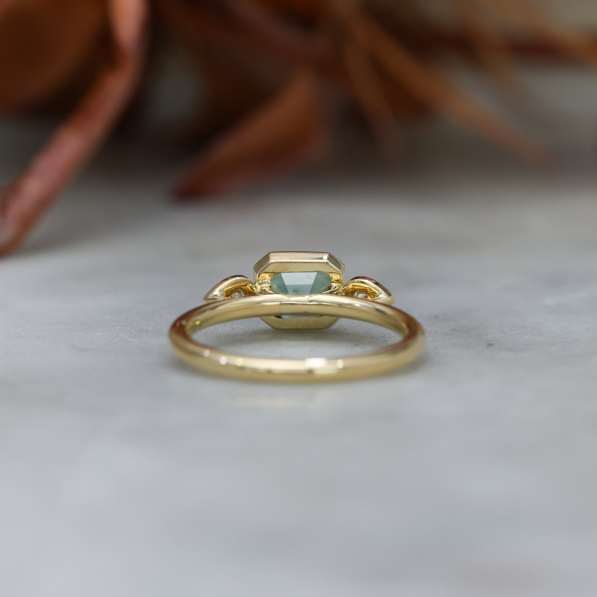 1.51ct Madagascan Sapphire and diamond Bezel trilogy engagement ring back view