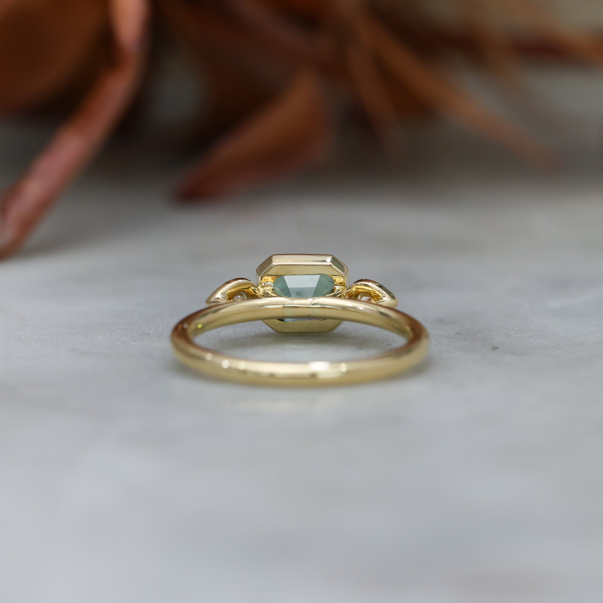 1.51ct Madagascan Sapphire and diamond Bezel trilogy engagement ring back view