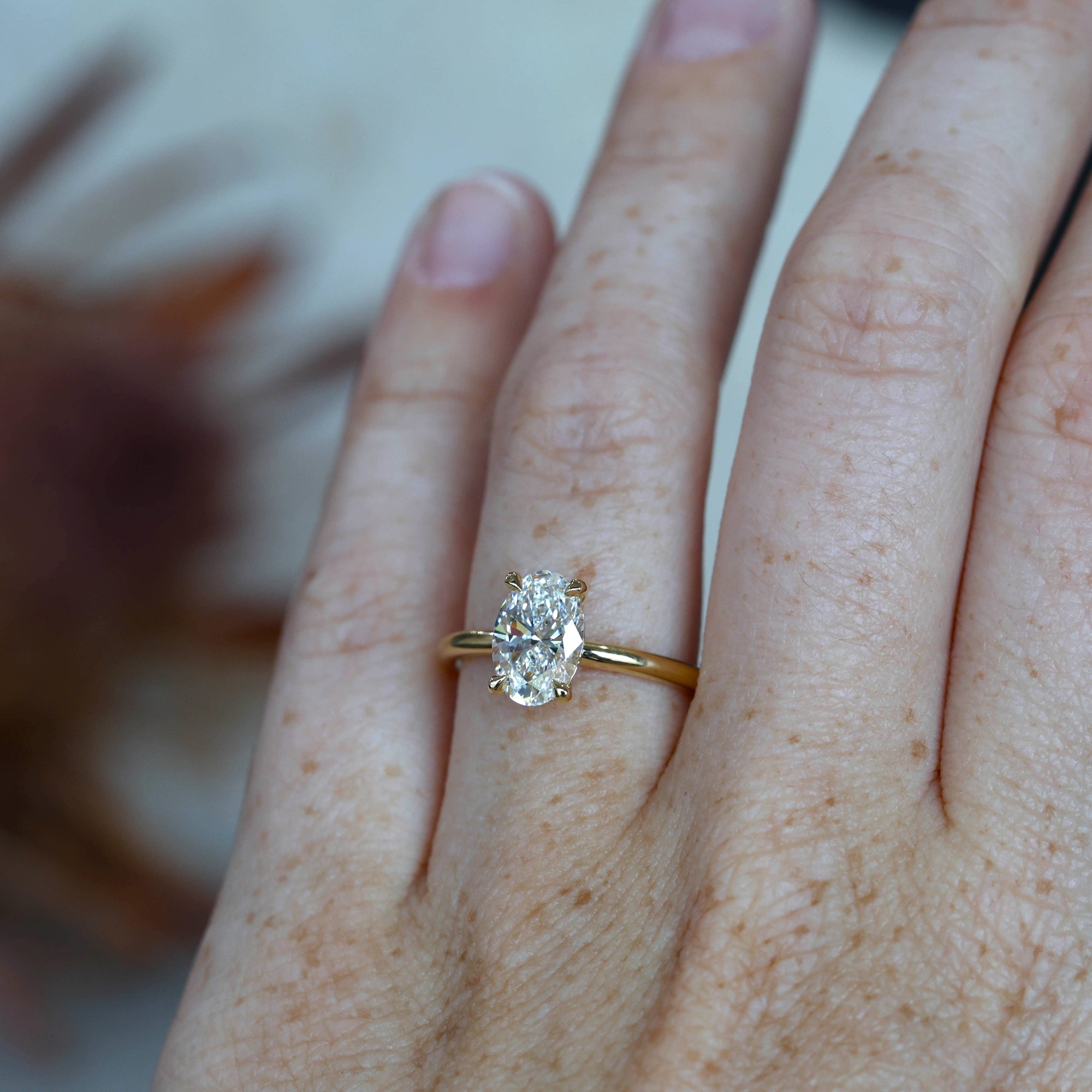 1.59ct Oval cut diamond solitaire engagement ring on hand