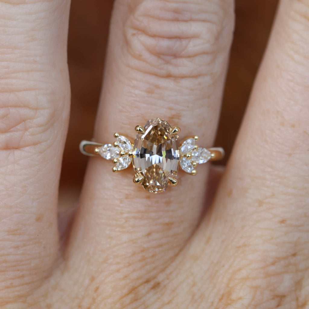 1.92ct oval step cut lab created champagne diamond engagement ring on hand
