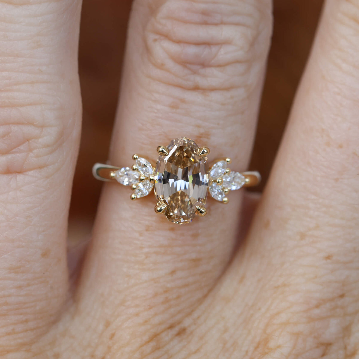 1.92ct oval step cut lab created champagne diamond engagement ring on hand