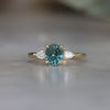 OVAL CUT TEAL SAPPHIRE / TRILOGY RING