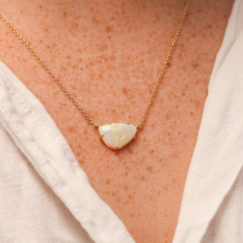 freeform south australian opal necklace in yellow gold on neck