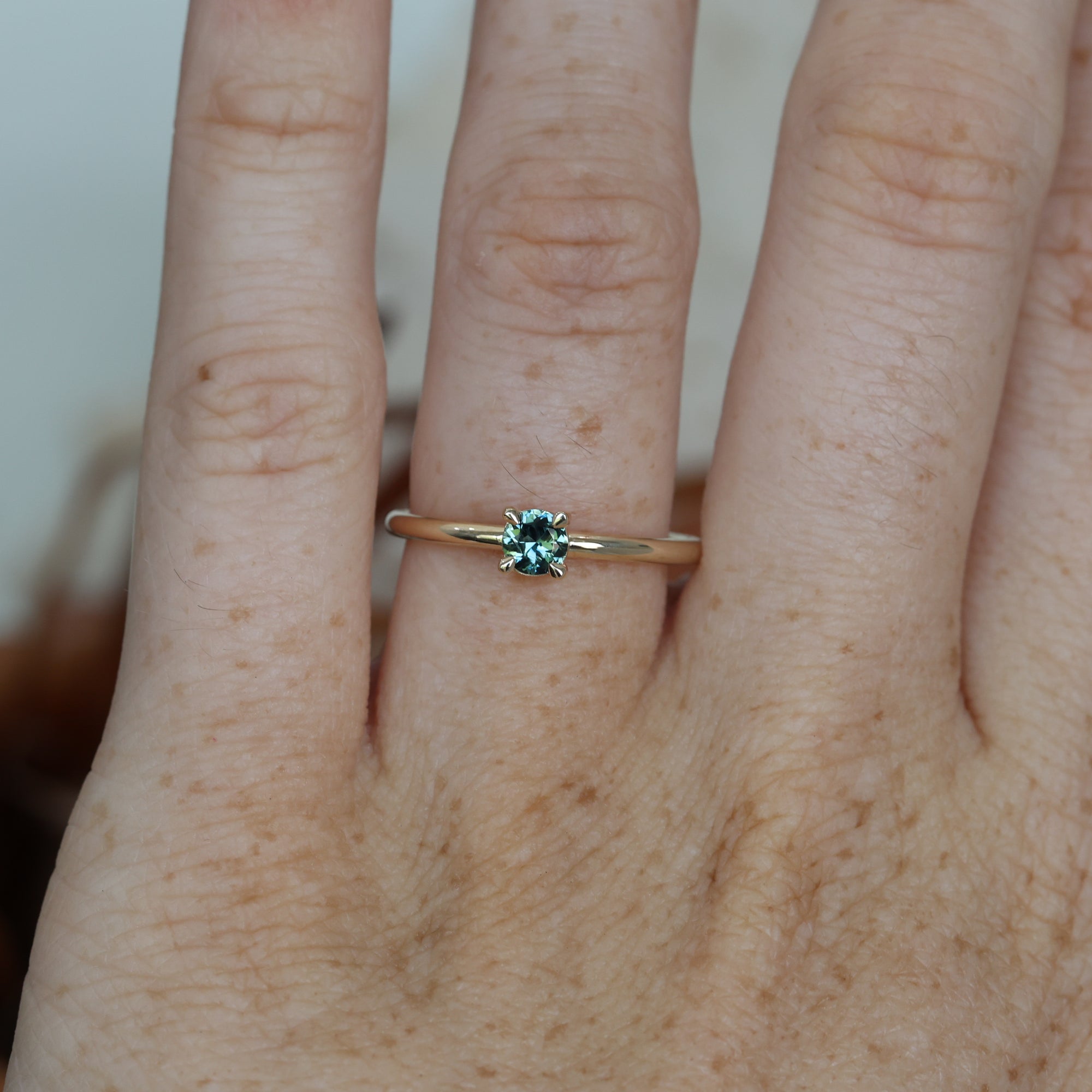 4mm round cut Australian Parti Sapphire stack ring crafted in yellow gold