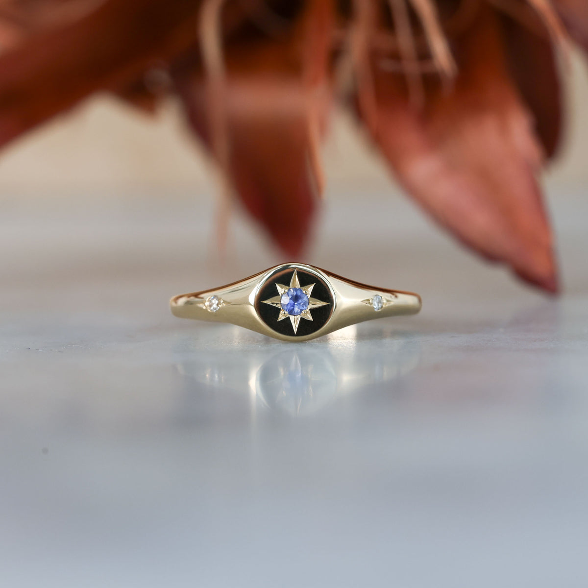 unique Ceylon sapphire and diamond signet ring in yellow gold