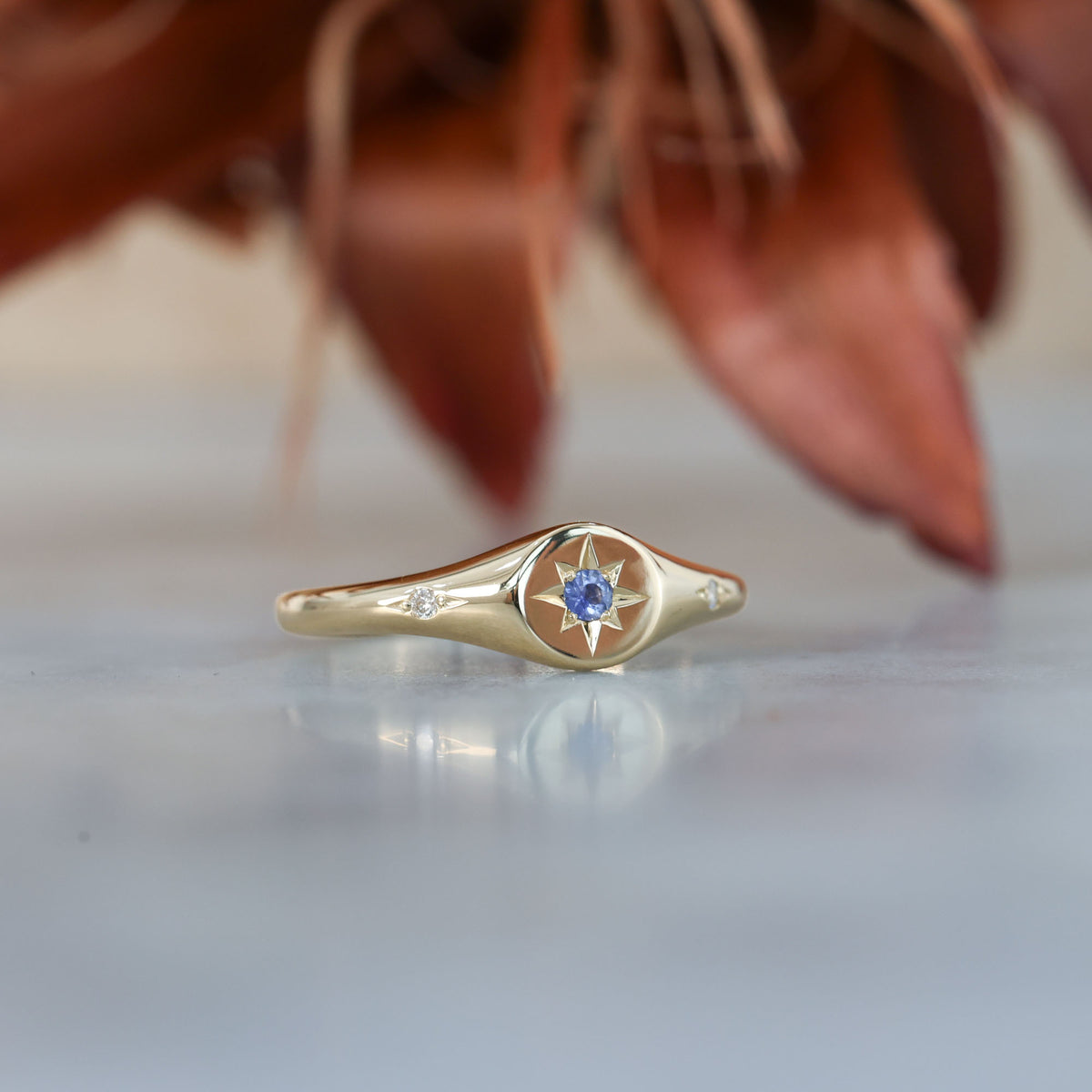 unique Ceylon sapphire and diamond signet ring in yellow gold
