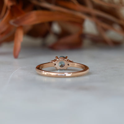 0.58ct Montana Sapphire trilogy engagement ring back view, rose gold band