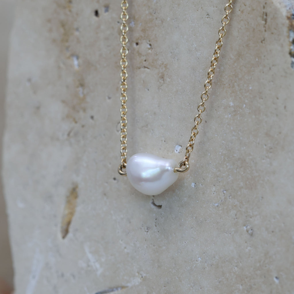 East west natural pearl necklace side